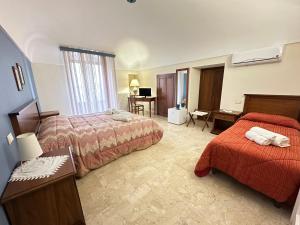 Posteľ alebo postele v izbe v ubytovaní Historic B&B Apartments Home
