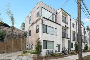an exterior view of a white building at Perch - Sand Point Haven in Seattle