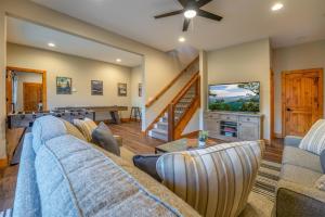 a living room with a couch and a table at Canopy Creek Connestee Falls in Brevard