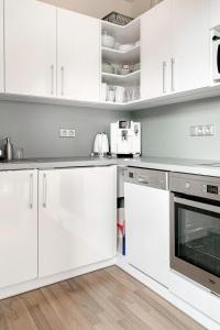 Kuchyň nebo kuchyňský kout v ubytování Apartmán s terasou