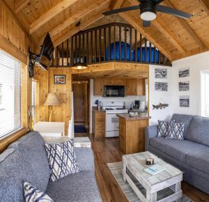 a living room with a couch and a table at Harbor Watch in Fort Bragg