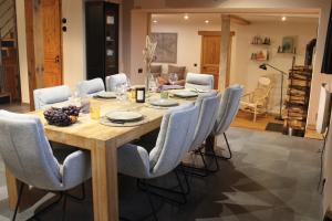 a dining room with a table and chairs at Le Gite des Croisettes in Les Croisettes