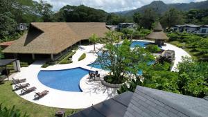 an aerial view of a resort with a swimming pool at Casa Cardumen - Ciudad Del Mar, in Jaco in Jacó