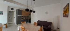 a kitchen and dining room with a table and chairs at Casamia in Follonica