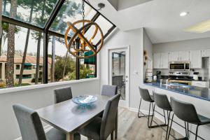 a kitchen and dining room with a table and chairs at 7474 Anchorage Villas in Hilton Head Island