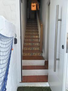 a hallway with a stairway leading up to a room at CASA MARINERA ALCOSSEBRE in Alcossebre