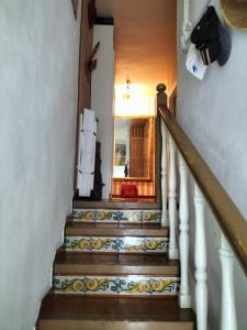 a staircase in a house with a stair case at CASA MARINERA ALCOSSEBRE in Alcossebre