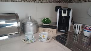 Coffee and tea making facilities at NSM Casa di Fulmine attico con box privato