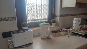 A kitchen or kitchenette at NSM Casa di Fulmine attico con box privato