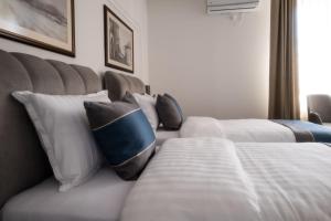 Postelja oz. postelje v sobi nastanitve Hotel Mio City