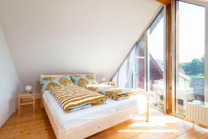 Letto o letti in una camera di Apartments Sopherl - by myNests