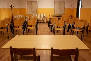 a room full of chairs and tables and a table and tablesktop at Casa per ferie Maria Ausiliatrice in Rome
