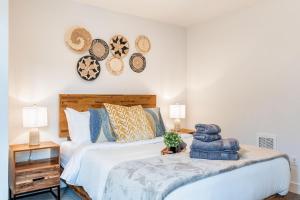 a bedroom with a bed with hats on the wall at Perch - View on Franklin in Seattle