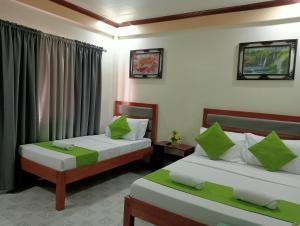 Postel nebo postele na pokoji v ubytování Bans Beach Resort + 5 fotografií