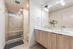 a bathroom with a sink and a shower at Perch - View on Franklin in Seattle +54 photos