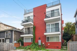 a red and white apartment building at Perch - View on Franklin in Seattle