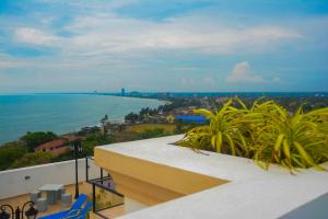 a view of the ocean from the balcony of a building at Luxury Apartment with Sea & Lagoon View  in Negombo