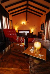 a living room with a table with a candle and wine glasses at INSPIRA THASSOS APARTMENTS and STUDIOS in Skala Sotiros +45 photos