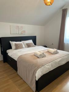 Postel nebo postele na pokoji v ubytování Apartman Magnolia
