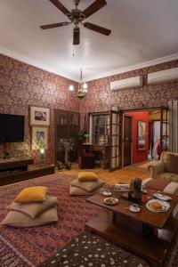 a living room with a couch and a table at Srinivas The Royal Residence, Jaipur in Jaipur