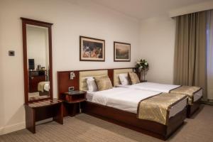 Postelja oz. postelje v sobi nastanitve Hotel Mio City