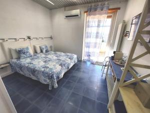 Postel nebo postele na pokoji v ubytování Nughe 'e' Oro Guesthouse