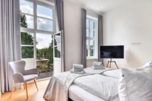 Postel nebo postele na pokoji v ubytování Ferienwohnung Kleine Auszeit in Putbus + 10 fotografií