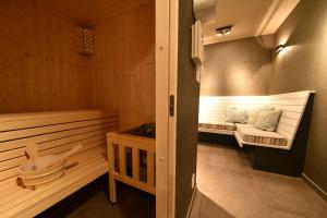 a room with a sauna with a bench in it at Ferienwohnung Sandbank in der Villa Martha Binz in Binz +8 photos
