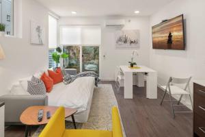 a living room with a couch and a table at Perch - Centro house F in Seattle +17 photos