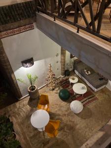 an overhead view of a living room with tables and chairs at Riad Dar Dayana in Essaouira +48 photos