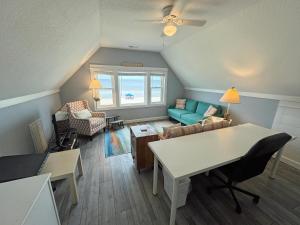 a living room with a couch and a table at KH4117- Beach Balm in Kitty Hawk