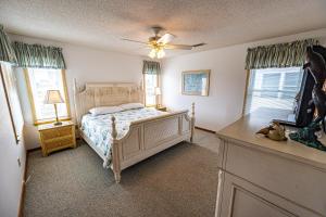 a bedroom with a bed and a ceiling fan at N2102- Sunny Daze in Nags Head
