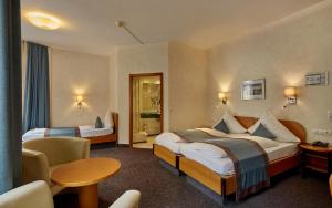 Postel nebo postele na pokoji v ubytování Trip Inn Hotel Hamm