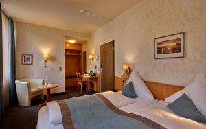 Postel nebo postele na pokoji v ubytování Trip Inn Hotel Hamm