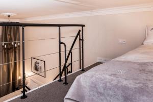 Posteľ alebo postele v izbe v ubytovaní Imagine Apartments