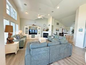 a living room with two couches and a tv at KH4508- Surf Par-Tee in Kitty Hawk