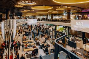a view of the lobby of a shopping mall at Modern 1BR Apartment with Balcony at Tripla Pasila, 5 mins to Helsinki City Center in Helsinki