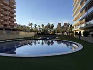 a large circular pool in the middle of a building at F10 - Vila D Orpesa X, World Lujo - ServHouse in El Borseral
