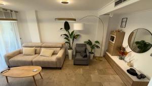 a living room with a couch and a table at F10 - Vila D Orpesa X, World Lujo - ServHouse in El Borseral