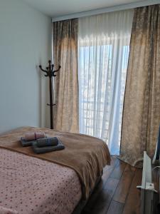 Rúm í herbergi á Apartman Monika Wind Resort