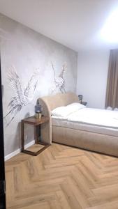 Postel nebo postele na pokoji v ubytování Villa Grudziądz