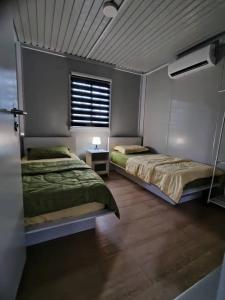 Ένα ή περισσότερα κρεβάτια σε δωμάτιο στο Shaza Homestay