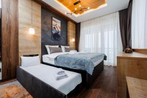 Katil atau katil-katil dalam bilik di Hotel Sedlo - Golija