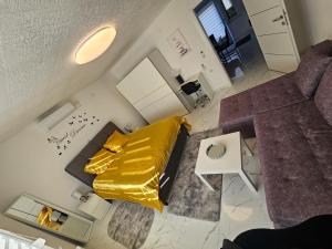 an overhead view of a bedroom with a yellow bed at ENA 1&2 apartments-free parking 2200 m2-truck,trailer,boats friendly-EASY D1 access in Karlovac