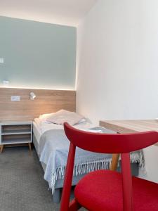Postel nebo postele na pokoji v ubytování Ośrodek Tulipan