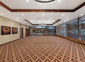 an empty ballroom with a large ceiling and windows at The Lodge at Jackson Hole in Jackson