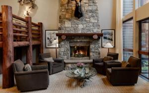 a living room with couches and a fireplace at The Lodge at Jackson Hole in Jackson
