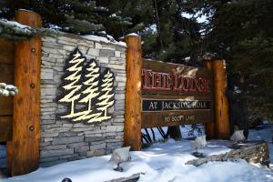 a sign for the ice lodge at jackson lodge in the snow at The Lodge at Jackson Hole in Jackson