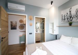 a bedroom with a white bed and a desk at Mystay - Riverview House in Porto