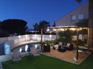 a backyard with a pool and a gazebo at The Lemon Grove House - large private garden, private pool - perfect for families in Torremolinos